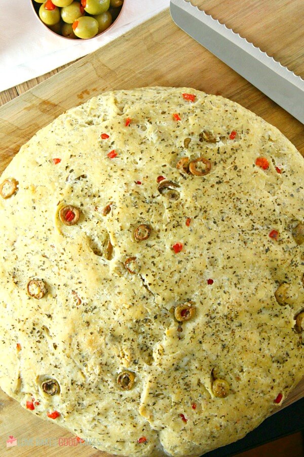 Skillet Bread on a cutting board with a knife for slicing.