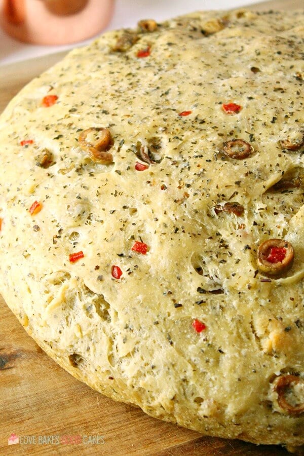 Bread baked on a cutting board showing surface texture.