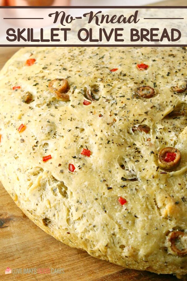 No-Knead Skillet Olive Bread! It's a super easy to make, crusty, homemade bread packed with olives and herbs.