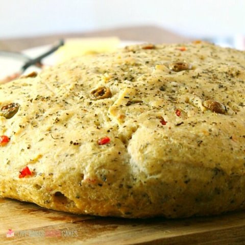 No-Knead Skillet Olive Bread! It's a super easy to make, crusty, homemade bread packed with olives and herbs.