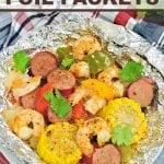 Spice up dinner with these Shrimp Boil Foil Packets! Bake or grill this easy mix of corn, sausage, shrimp, onions, and bell peppers with a zesty Cajun seasoning mix.