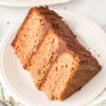 Square photo of sliced Chocolate Milk Cake Recipe with creamy chocolate buttercream frosting