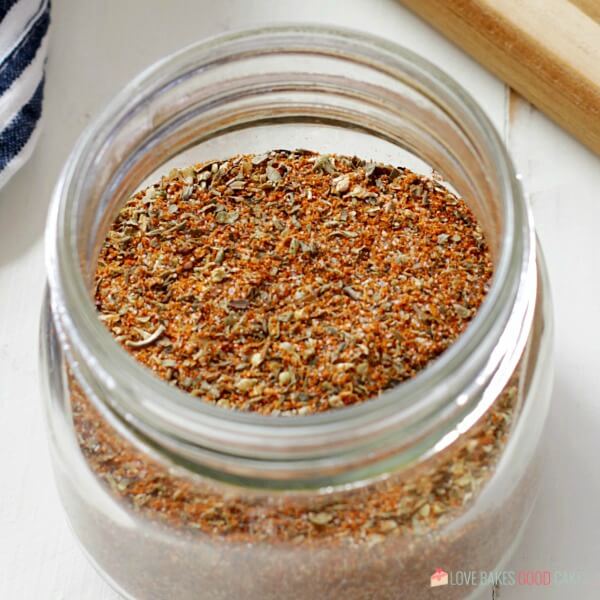 square image Homemade Cajun-Creole Seasoning in jar on white background