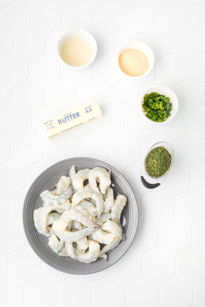 Raw jumbo shrimp, butter, lemon juice, garlic powder, parsley, and chives.