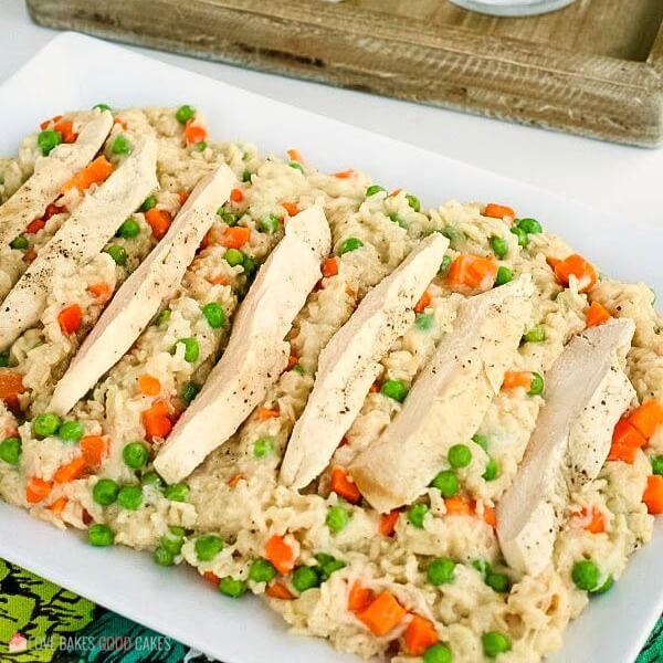 Chicken and rice cooked in a slow cooker served on a platter.