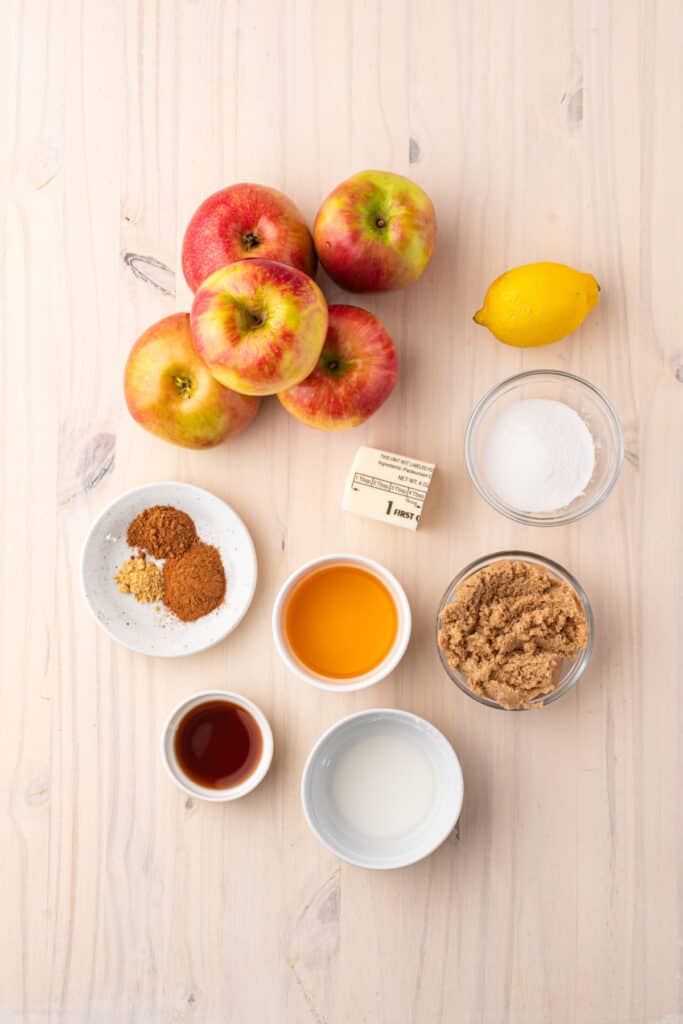 Ingredients for Southern Fried Apples including Honeycrisp apples, butter, brown sugar, spices, apple juice, vanilla, and lemon.