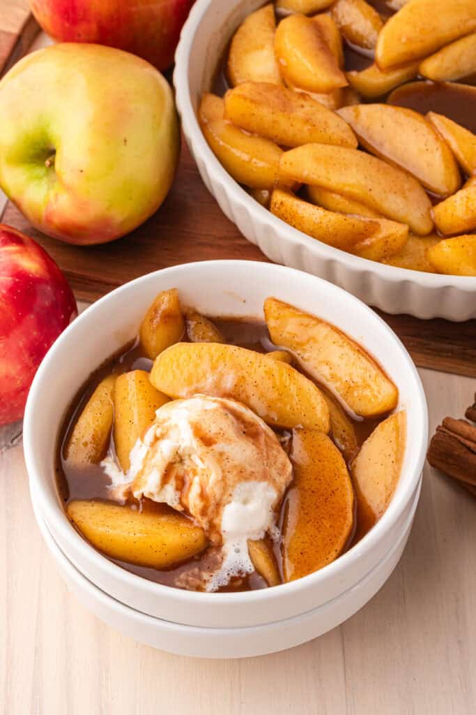 Warm Southern Fried Apples served with a scoop of vanilla ice cream for dessert.
