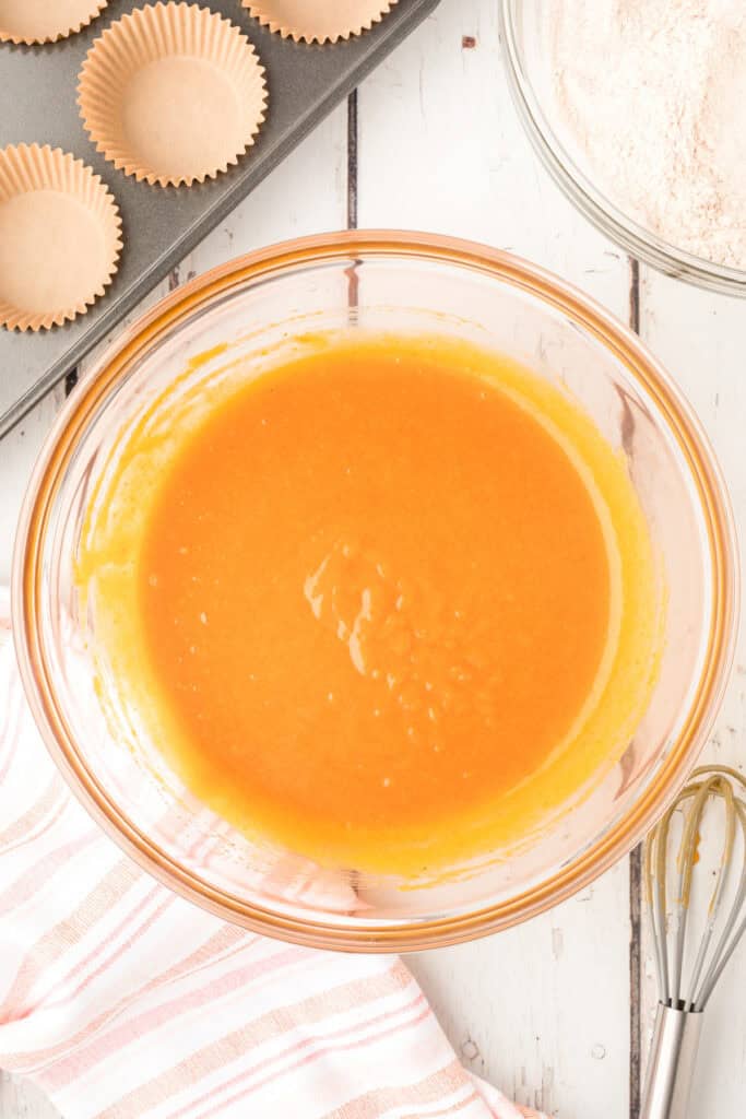 Wet ingredients fully whisked together into a smooth orange mixture