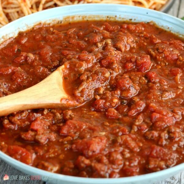 Slow Cooker Spaghetti Sauce that is as easy as throwing everything into your slow cooker. Economical and great for busy weeknights. Slow Cooker Spaghetti Sauce in a bowl.