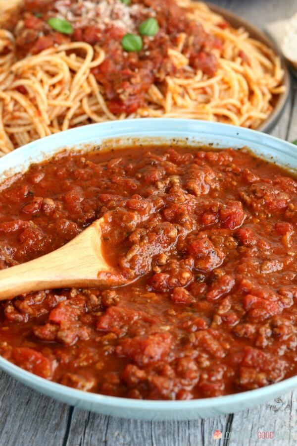 Slow Cooker Spaghetti Sauce that is as easy as throwing everything into your slow cooker. Economical and great for busy weeknights. Slow Cooker Spaghetti Sauce with pasta.