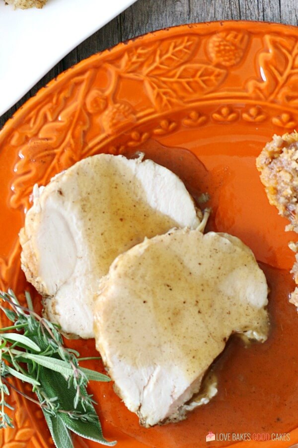 If you love turkey breast, and you love your Instant Pot, this is your turkey breast recipe! Juicy and easy-to-make with a heavenly gravy to boot! Instant Pot Turkey Breast on a plate with gravy.