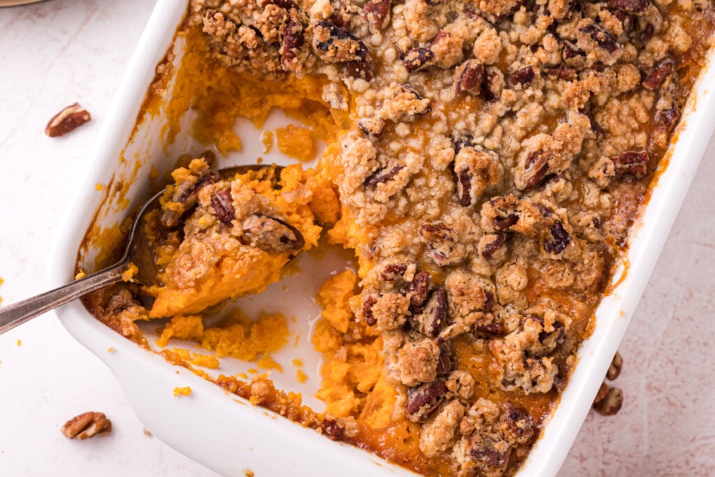 spoon scooping out sweet potato casserole