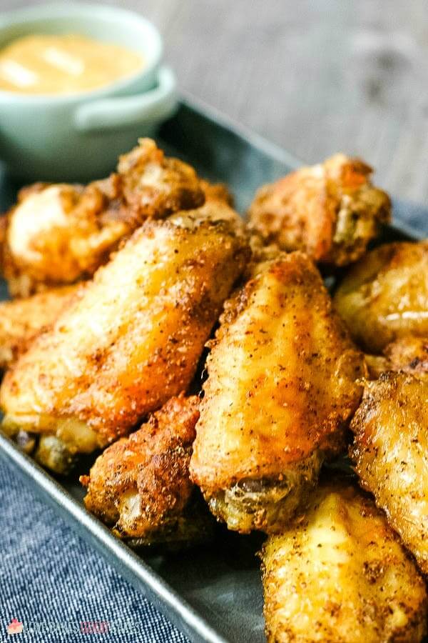 Finished air fryer chicken wings on a plate ready to be eaten. 