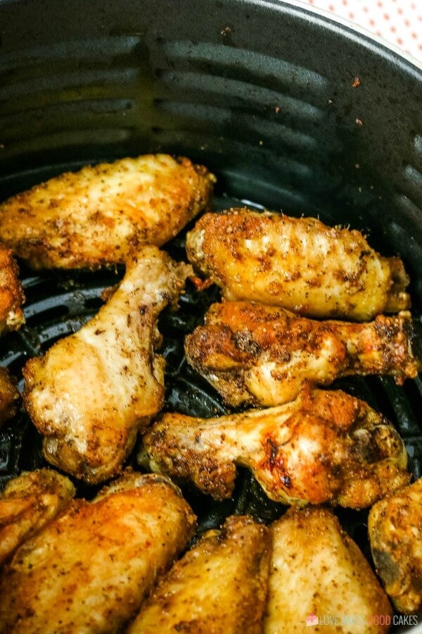 A shot of the finished air fryer wings in the cooking basket ready to be served. 