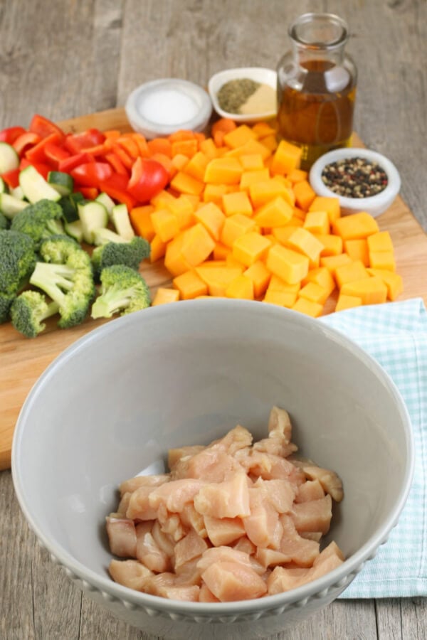 Sheet pan meals are great! This Healthy Sheet Pan Chicken and Veggies Meal is made with chicken and vegetables and makes for a great meal prep recipe! Up next we have to prepare the chicken and vegetables so they can be seasoned.