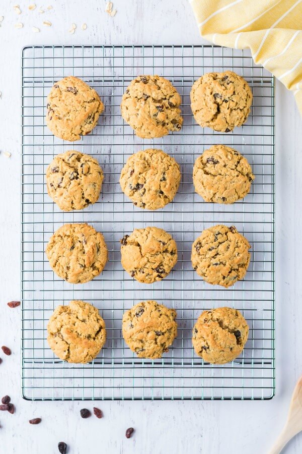 Easy recipe for the ultimate Oatmeal Raisin Cookies - slightly crunchy on the outside with a perfectly soft, heavenly chewy texture when you bite into them. easy recipe for oatmeal raisin cookies on cooking rack