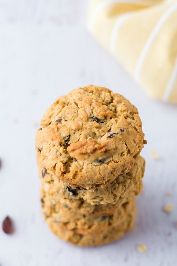 Easy recipe for the ultimate Oatmeal Raisin Cookies - slightly crunchy on the outside with a perfectly soft, heavenly chewy texture when you bite into them. easy recipe for oatmeal raisin cookies in a stack