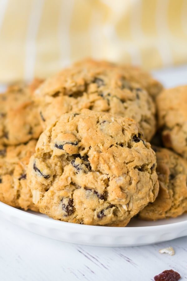 Easy recipe for the ultimate Oatmeal Raisin Cookies - slightly crunchy on the outside with a perfectly soft, heavenly chewy texture when you bite into them. cookies on a plate