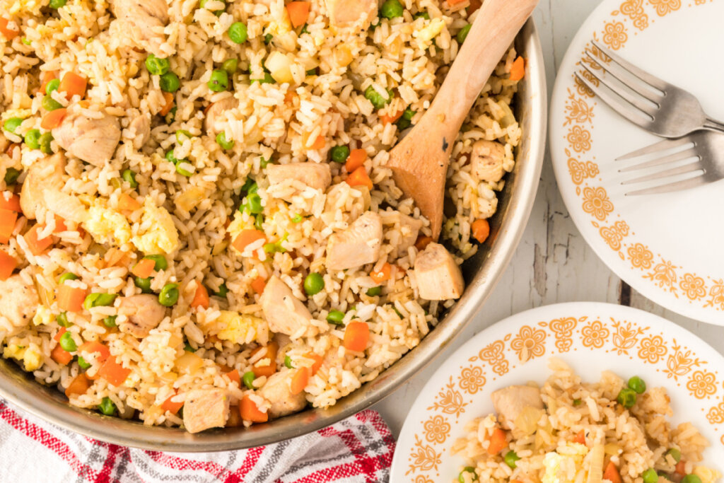 skillet and plate with chicken fried rice