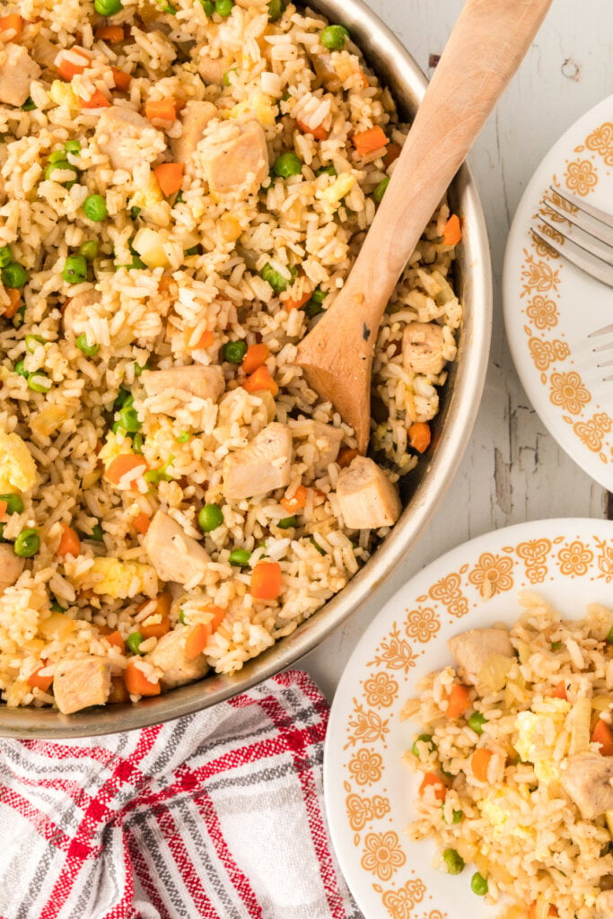 plate and skillet with chicken and fried rice
