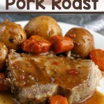 pork roast with potatoes, carrots and gravy on plate