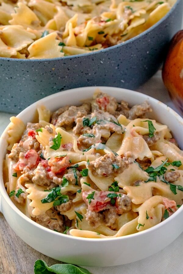 This Italian Sausage Bow Tie Pasta is easy - and reminds me of something you would get at an Italian restaurant. Our family loves it ... and I hope yours does too! italian sausage and bow tie pasta recipe in bowl