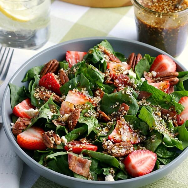 closeup of finished strawberry spinach salad