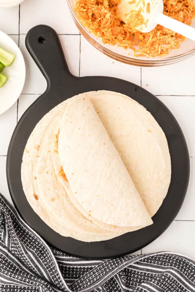 Folded Buffalo Chicken Quesadillas before cooking in a skillet