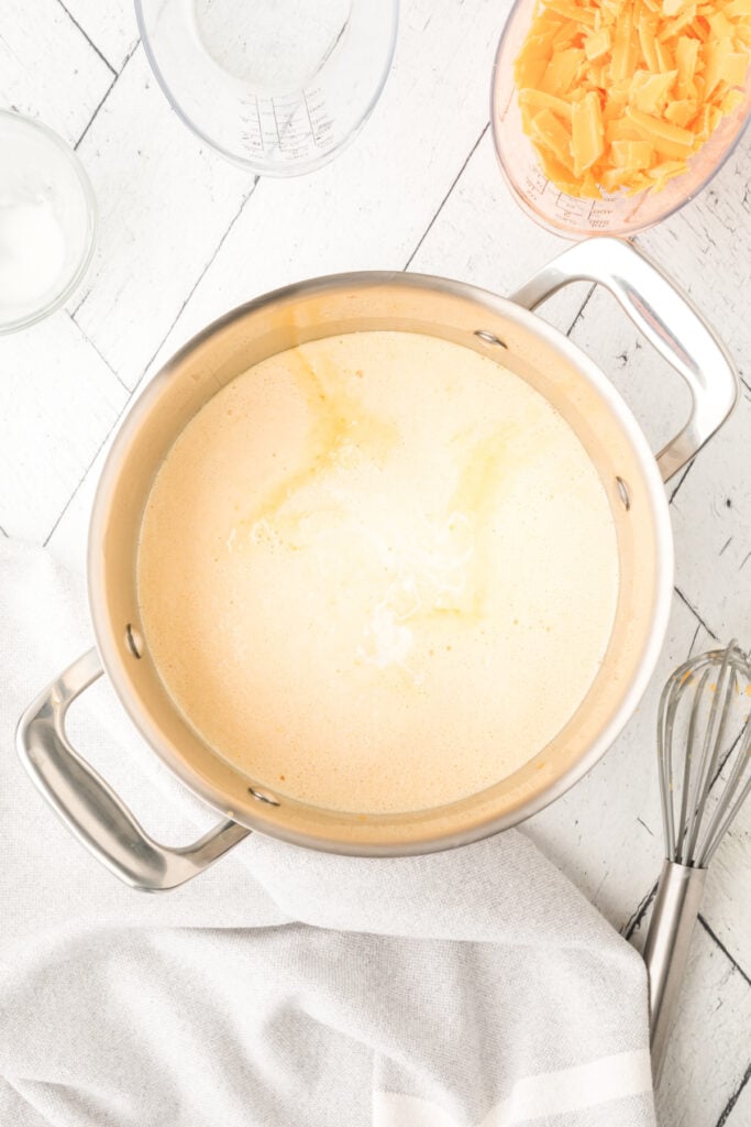 saucepan with milk mixture starting to heat and slightly thicken