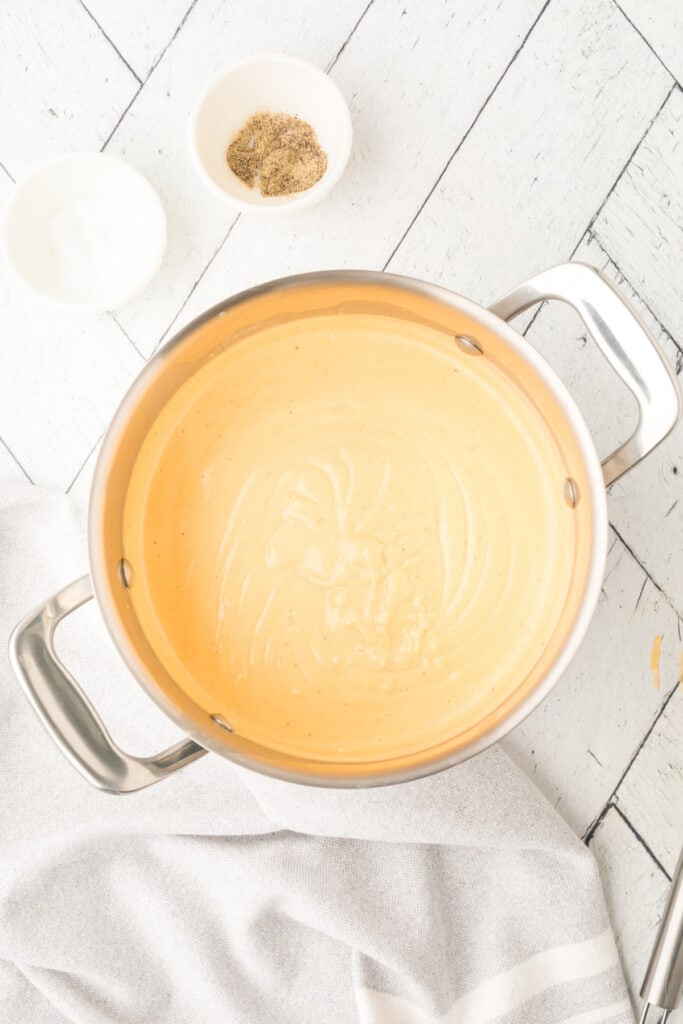 saucepan with fully combined smooth beer cheese dip