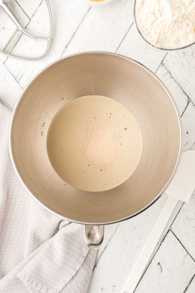 Combine warm water, sugar, salt, and yeast in your stand mixer bowl.