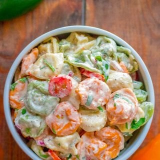 overhead shot of recipe for tortellini pasta salad in bowl