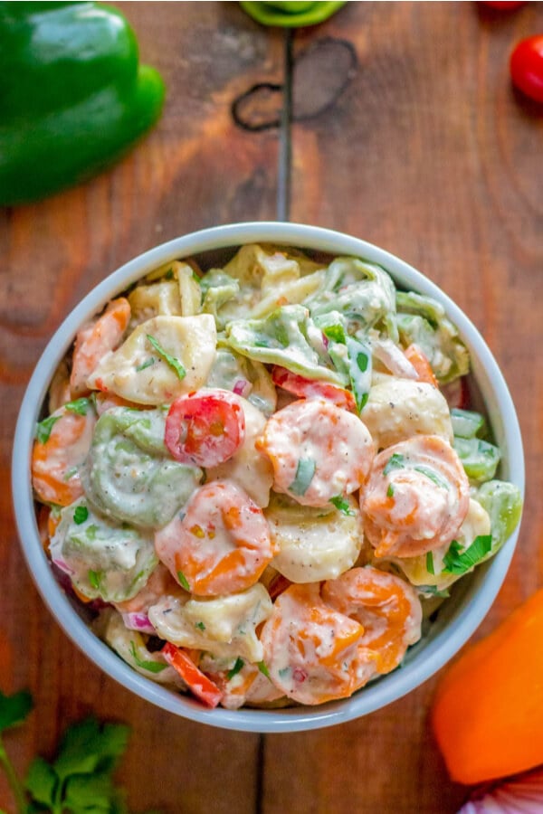 overhead shot of recipe for tortellini pasta salad in bowl