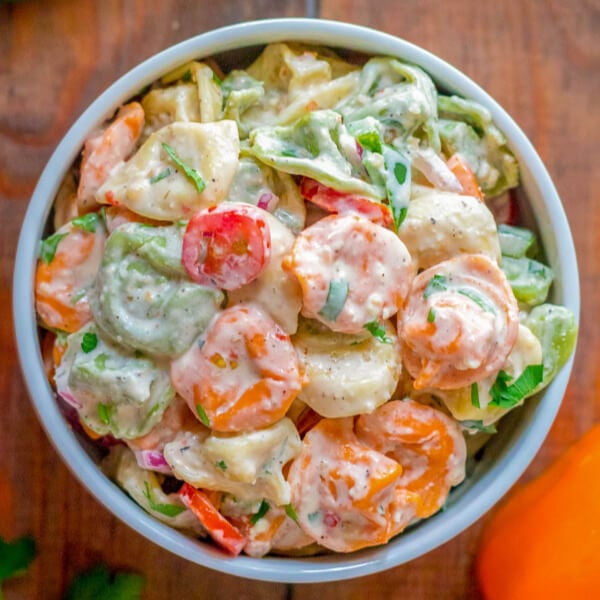 closeup overhead shot of tortellini pasta salad in bowl