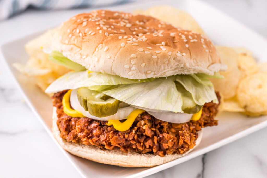 breaded pork tenderloin sandwich on plate