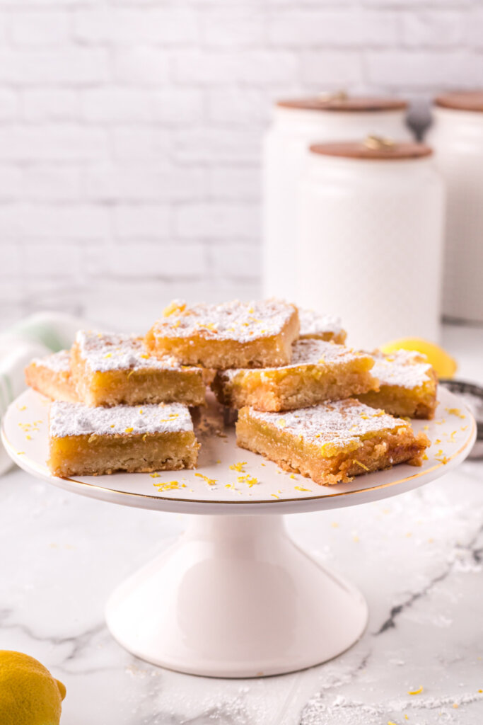 lemon bars on cake stand