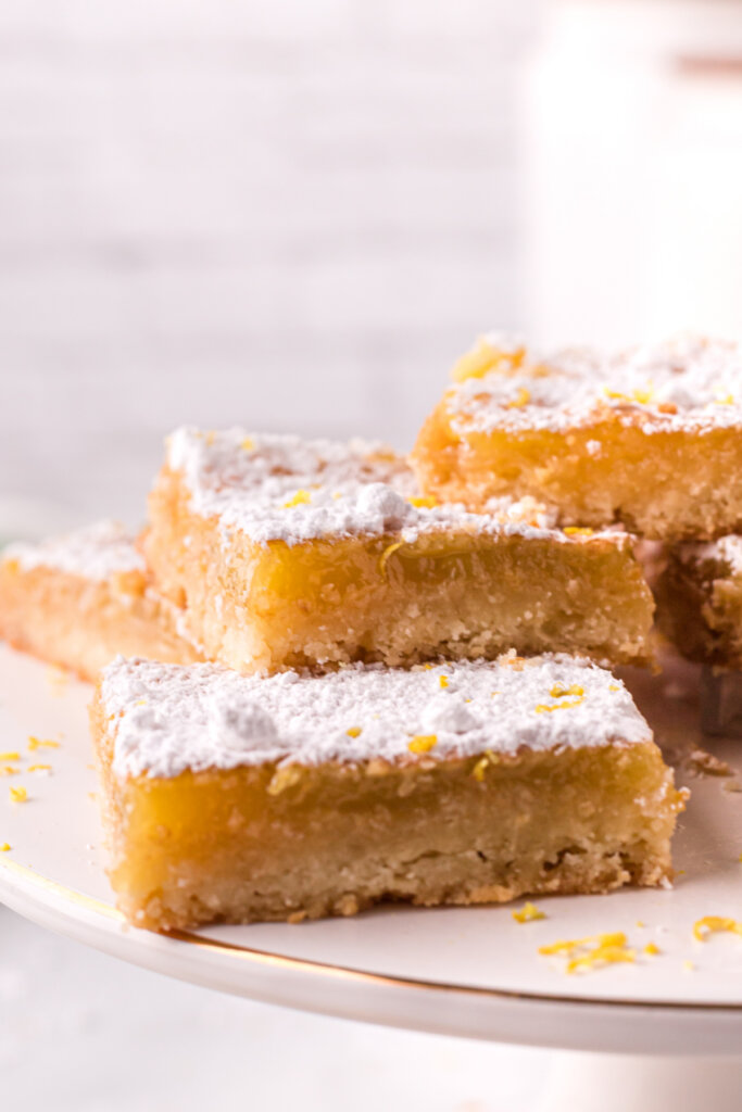 closeup of lemon bars on cake stand