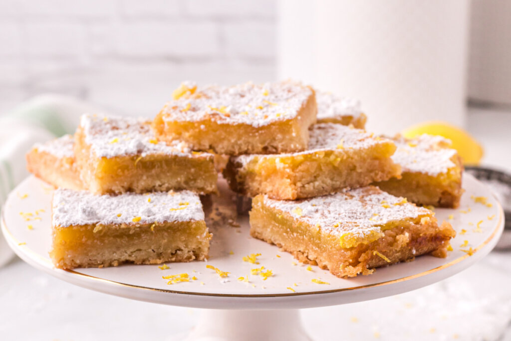 lemon bars on cake stand