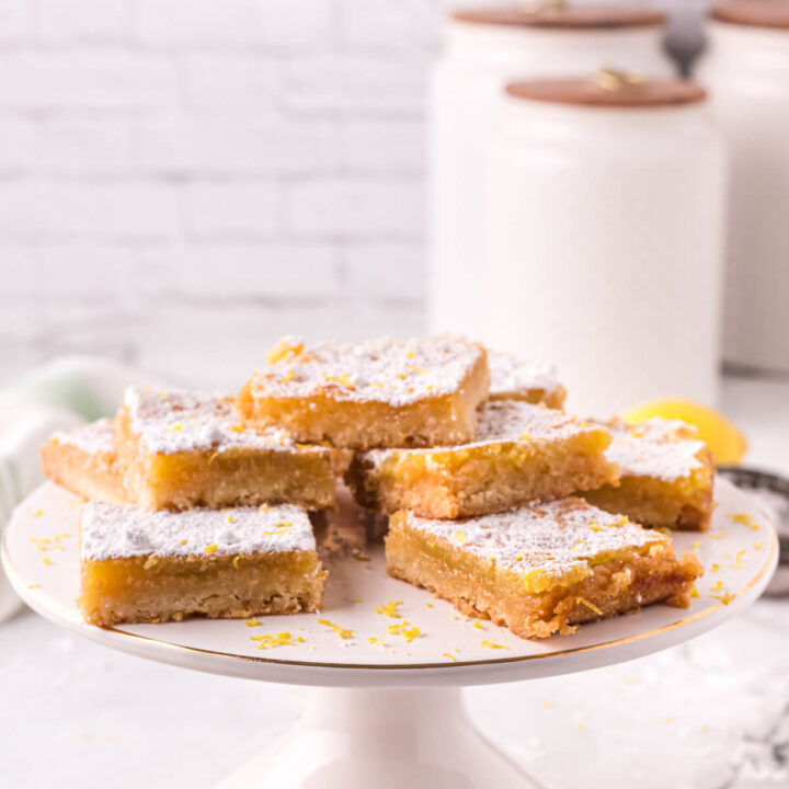 lemon bars on cake stand