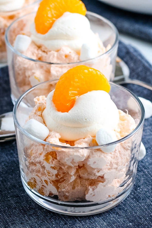 finished orange fluff salad in clear bowl