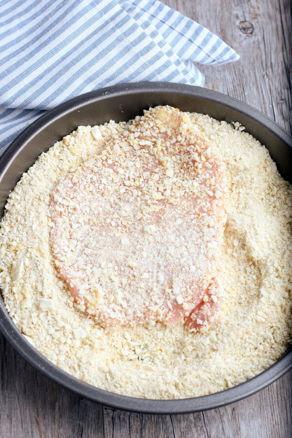 pork tenderloin fully coated with cracker meal