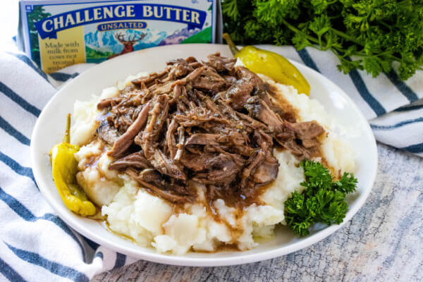 Mississippi Pot Roast over mashed potatoes made with Challenge butter