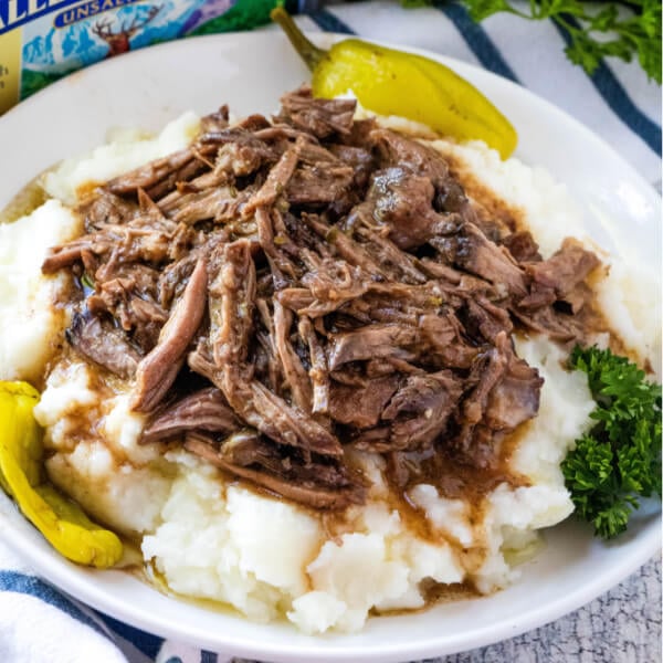 pot roast with gravy over mashed potatoes
