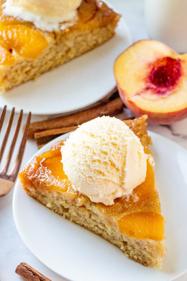 cake slice with ice cream scoop on top on plate