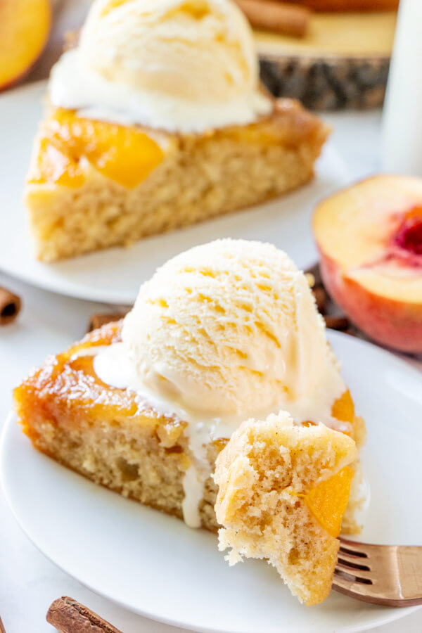 cake slice on plate with bite on fork