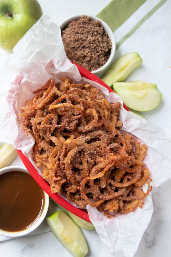 looking down on a basket of cinnamon apple curly fries