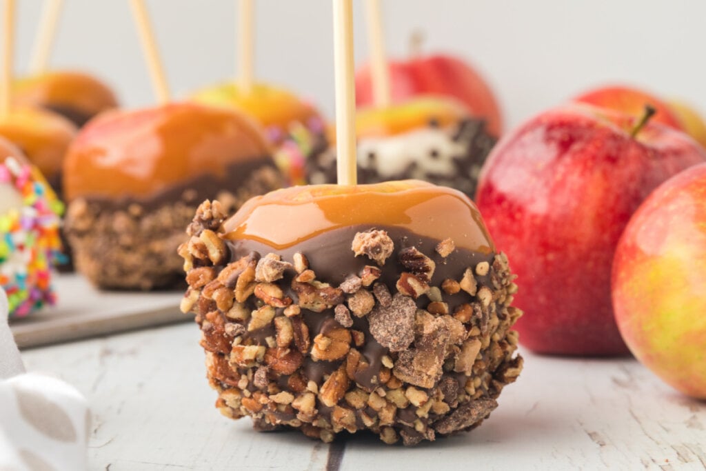caramel apple coated with chopped candy bar