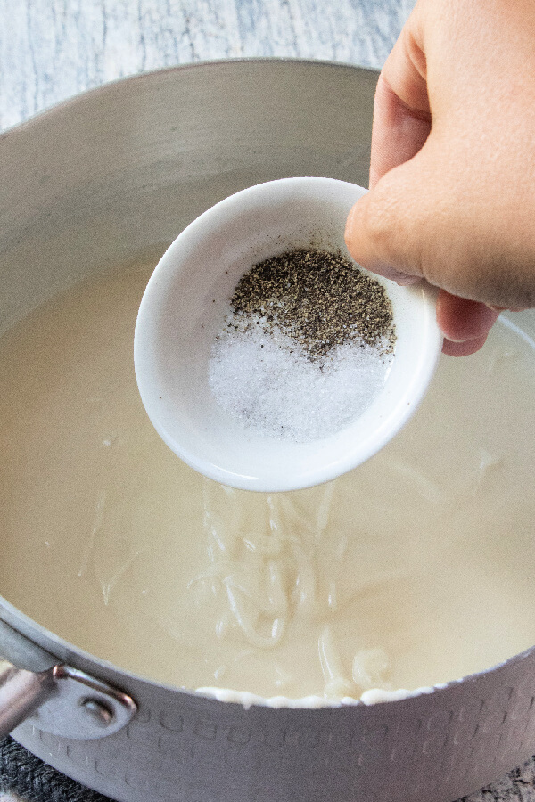 salt and pepper being added to the mixture