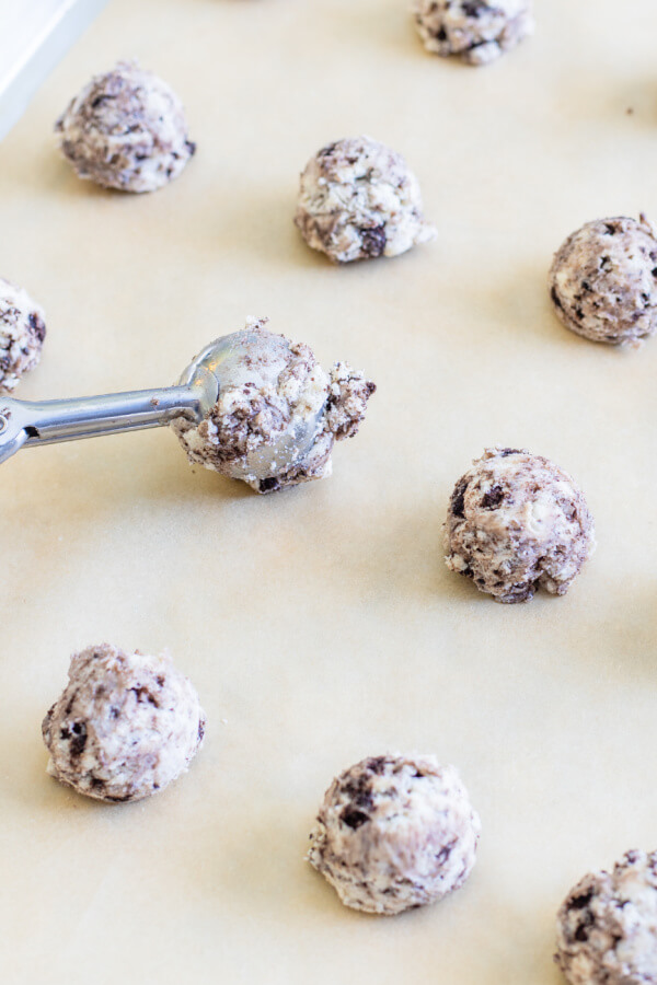 dough being scooped onto baking sheet