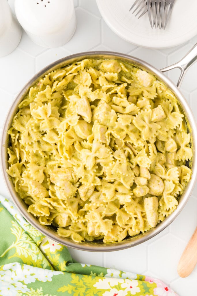 creamy chicken pesto pasta in a skillet